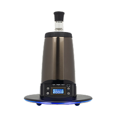 A sleek, metallic desktop vaporizer with a digital display on a black background.